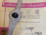 a watch that is laying on top of a piece of paper