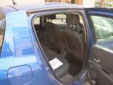 a blue car with its door open next to a blue car with its door open