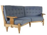 an image of a blue couch with a wooden frame