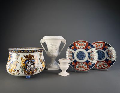 several different types of vases and plates on a gray surface