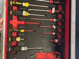 a red tool box with a bunch of tools inside of it