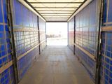 an image of a long hallway leading to a building