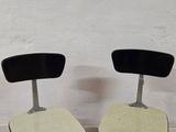 two chairs sitting next to each other on the floor