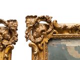 pair of ornate gold framed mirrors with a painting of a woman and a man