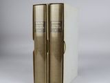 a pair of books sitting on top of each other on a table