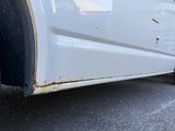 a white van parked on the side of the road