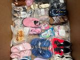 a box full of baby shoes and shoes that are in it