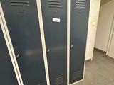 three lockers in the hallway of a building