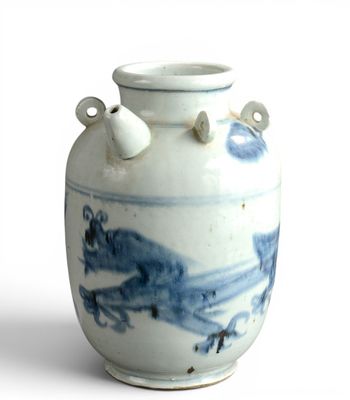 a blue and white vase with two handles on a white surface