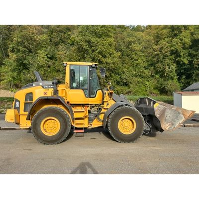 a large yellow bulldozer that is parked in the parking lot