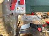 someone is using a circular saw to cut a piece of metal