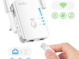 an image of a hand is holding a wireless router and plugged in to it