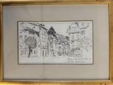 framed drawing of a street scene with buildings and a man