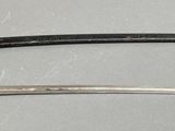two swords that are on display on a table