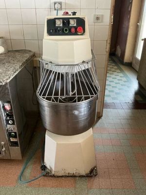 an image of a kitchen with a mixer and a counter