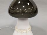 a black and white mushroom shaped lamp with a white base
