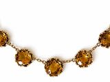 a close up of a necklace on a white background