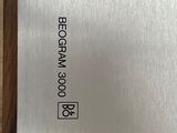 a close up of a metal plate with a black dot on it