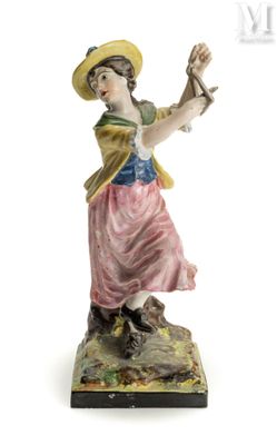 une image représentant une figurine de femme tenant un oiseau dans la main