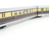 a model train that is sitting on a white surface