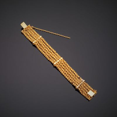 a gold bracelet with a chain and clasp