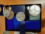 a box of coins and a wallet on a table