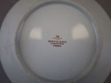 a white plate with a red and black logo on it