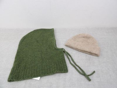 two hats that are sitting on a table