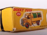 a yellow box with a picture of a dump truck on it