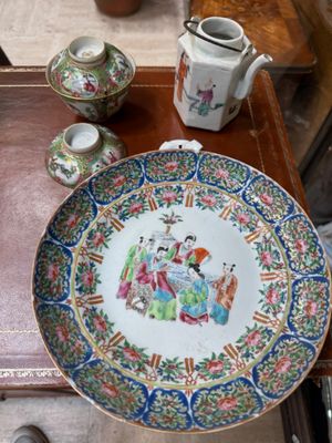 a plate with a picture on it sitting on a table