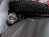 a bicycle tire and a soccer ball in a bag