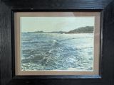 framed picture of a picture of a body of water with a boat in the distance