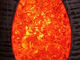 a close up of a vase with a red light inside of it