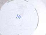 a white plate with a blue and white design on it
