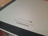 a close up of a person holding a tablet computer