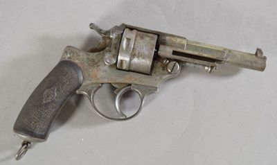 a small gun that is on a white surface