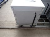 a white box sitting on top of a cart in a store