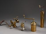 several different types of brass objects are displayed on a gray surface