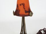 a lamp that is sitting on a table with a cord