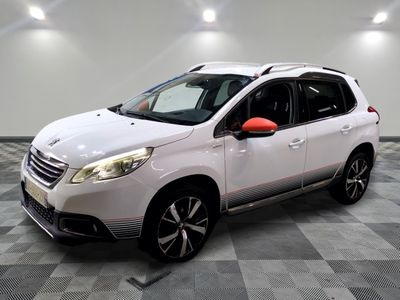 the white car is parked on a checkered floor in the garage