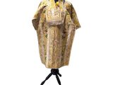 an image of a dress on a mannequin stand on a white background