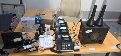 a table with a lot of electronics on top of it