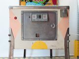 a machine that is sitting on a stand in a room