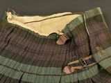 a green and brown plaid skirt with buttons on it