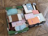 a box full of books on the floor on the floor