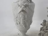 two vases sitting next to each other on top of a table