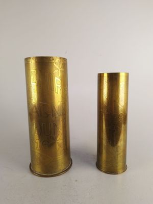 pair of brass vases on a white background