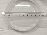 a measuring tape on a plastic bowl with a measuring tape