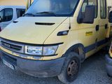 a yellow van that is parked in front of a building