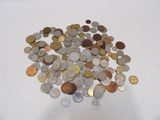 a pile of coins sitting on a white table